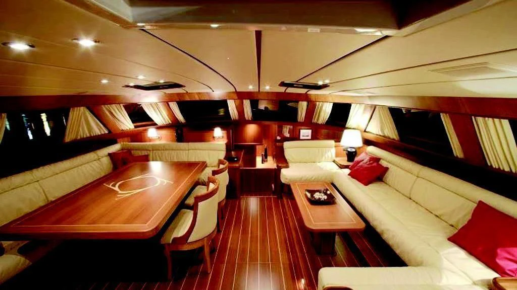 a room with a bed and a table aboard STARFALL Yacht for Sale