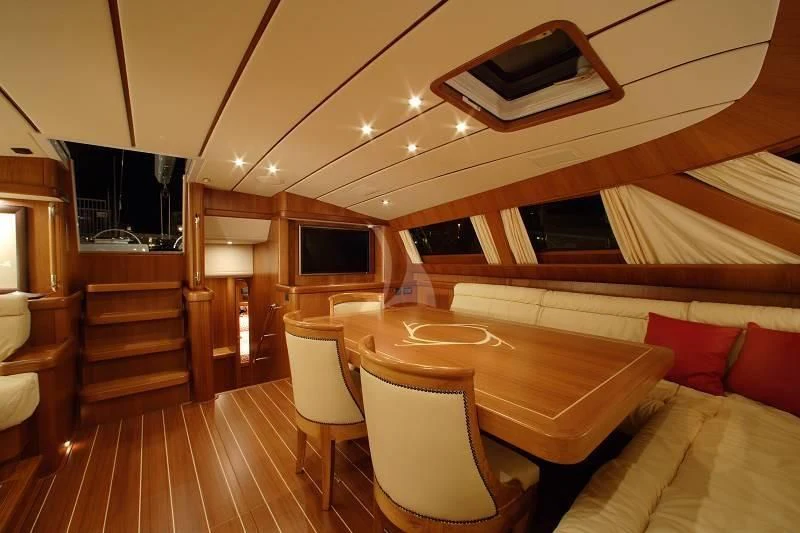 a room with a table and chairs aboard STARFALL Yacht for Sale