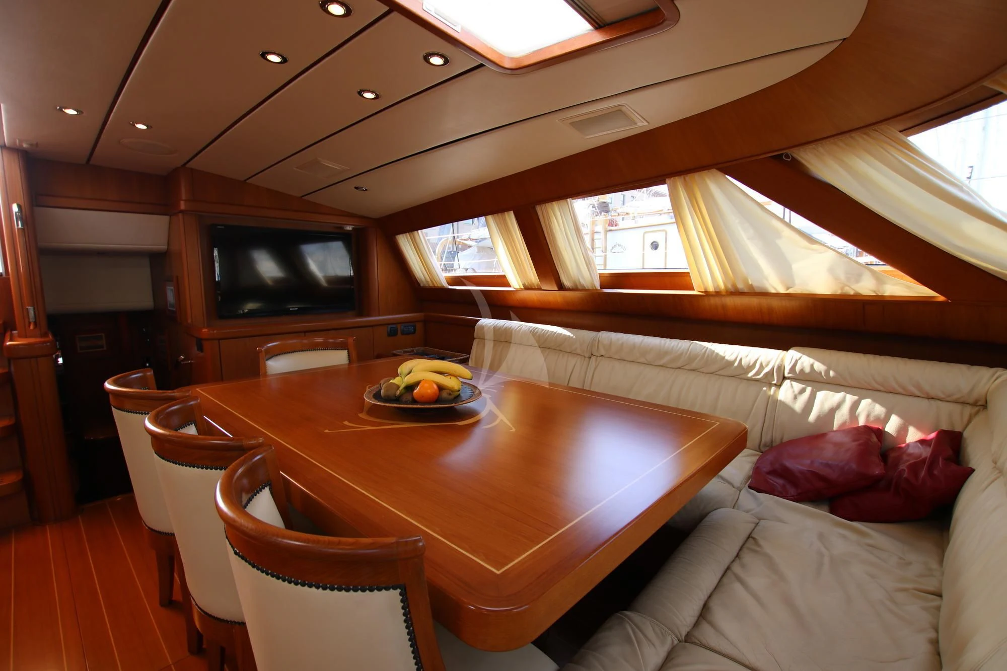 a room with a table and chairs aboard STARFALL Yacht for Sale