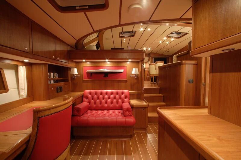 a room with a table and chairs aboard STARFALL Yacht for Sale
