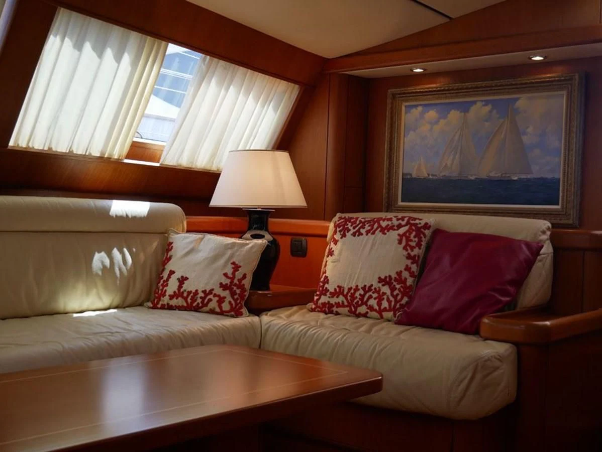 a living room with a couch and a table aboard STARFALL Yacht for Sale