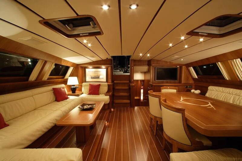 a room with a couch and a television aboard STARFALL Yacht for Sale