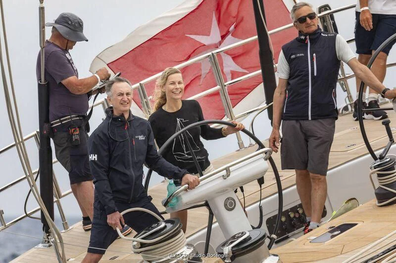 a woman and a man on a bike aboard STARFALL Yacht for Sale
