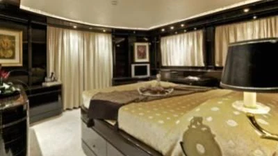 a large bedroom with a large bed aboard O'RION Yacht for Charter