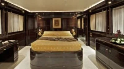 a bedroom with a large bed aboard O'RION Yacht for Charter