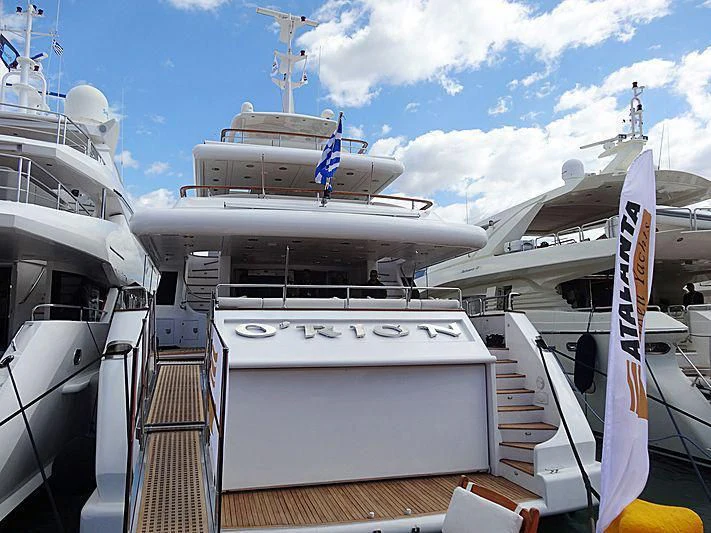 a boat docked at a pier aboard O'RION Yacht for Charter
