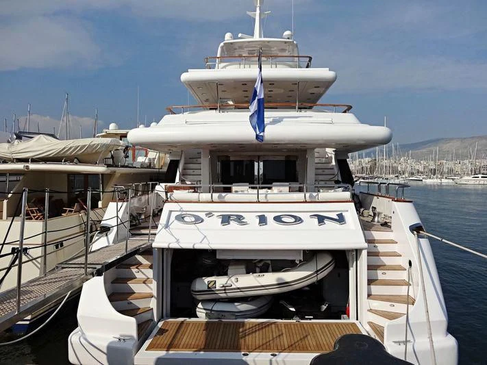 a large white boat docked aboard O'RION Yacht for Charter