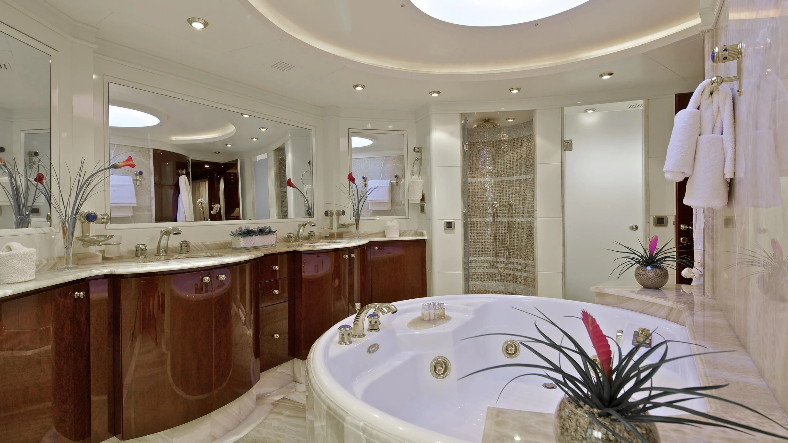 a bathroom with a large mirror aboard O'RION Yacht for Charter