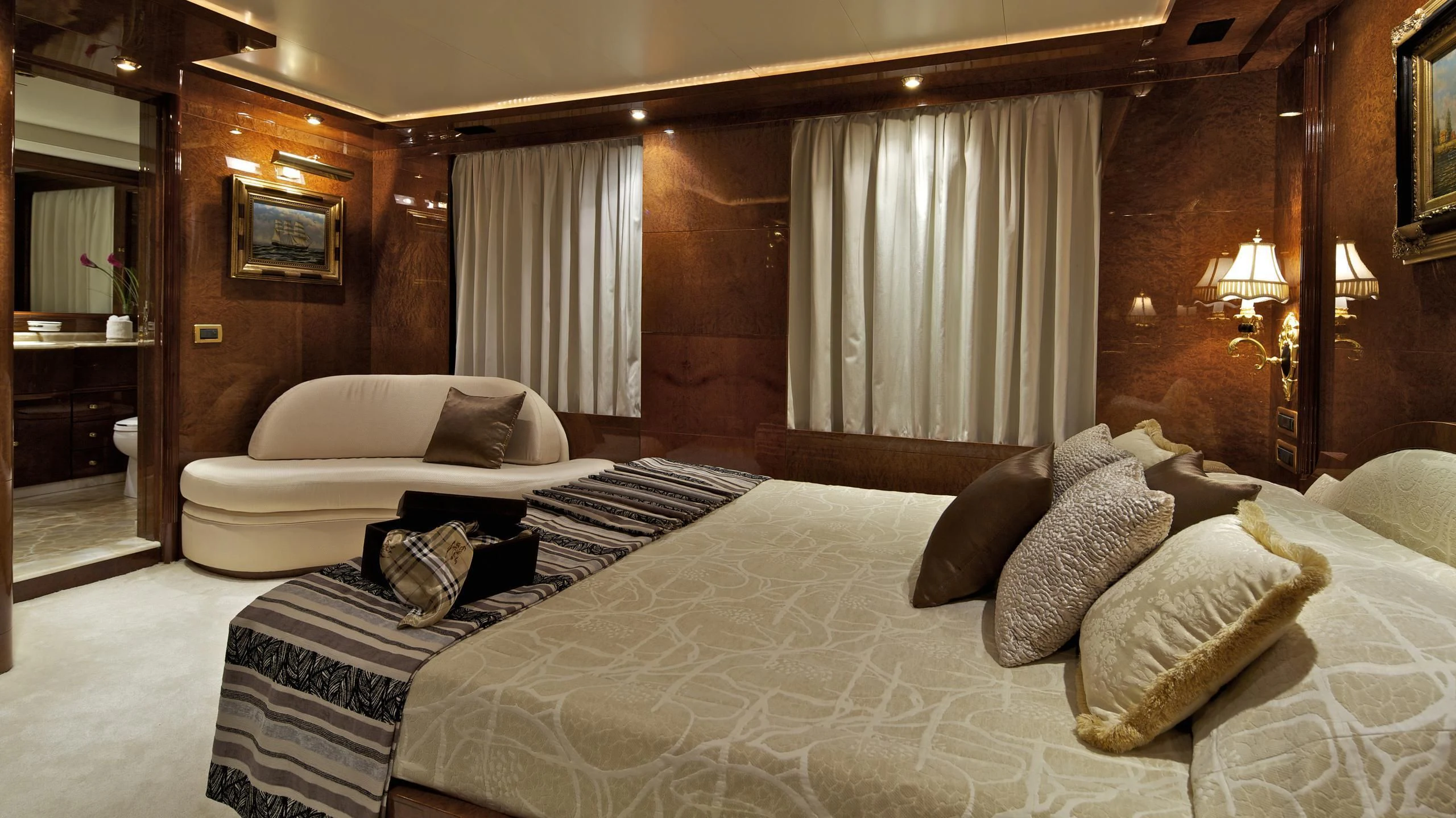a couple of beds in a hotel room aboard O'RION Yacht for Charter