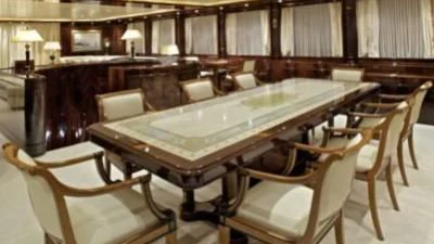 a room with a table and chairs aboard O'RION Yacht for Charter