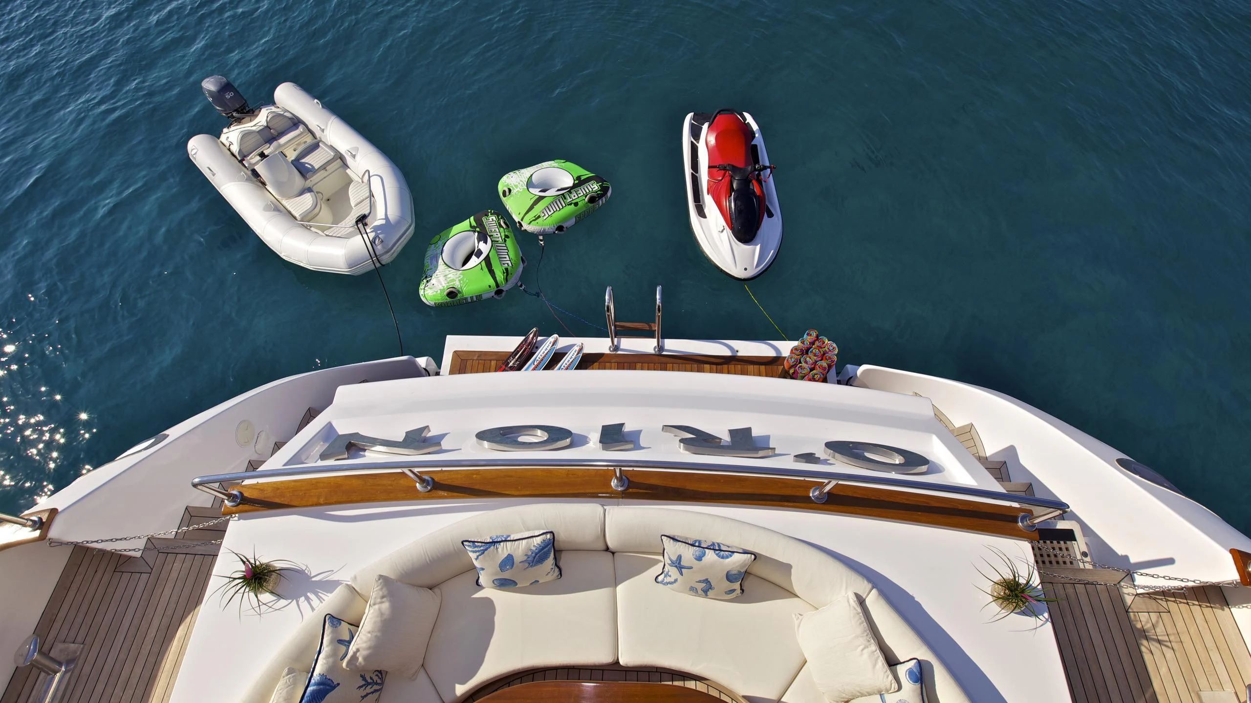 a group of boats on a body of water aboard O'RION Yacht for Charter
