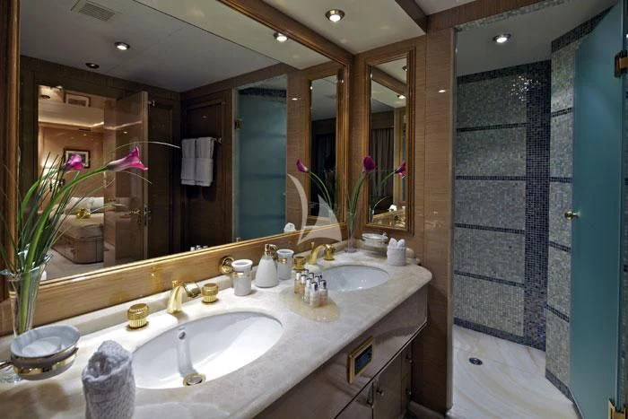 a bathroom with a large mirror aboard O'RION Yacht for Charter