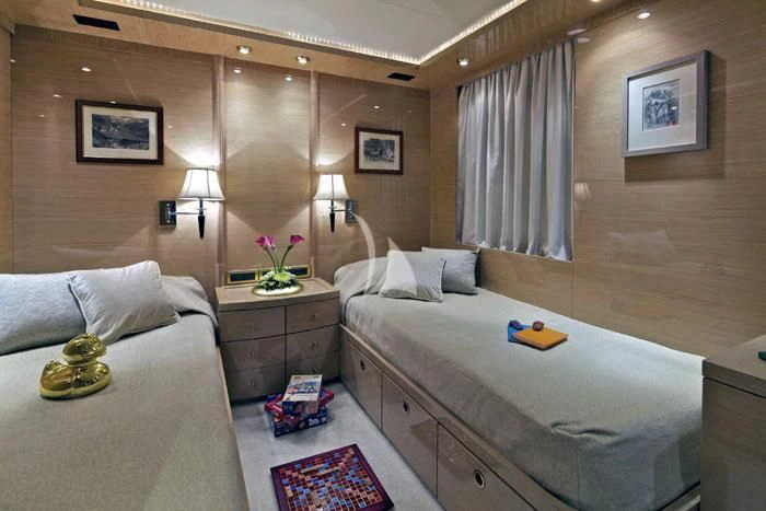 a room with a bed and a mirror aboard O'RION Yacht for Charter