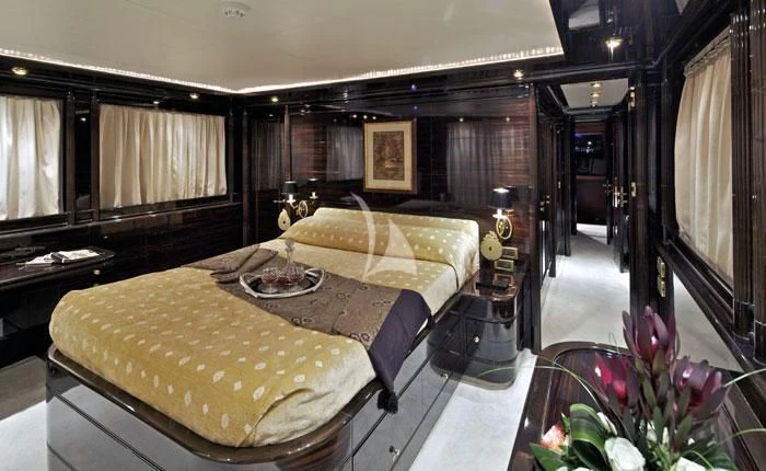 a hotel room with a bed aboard O'RION Yacht for Charter