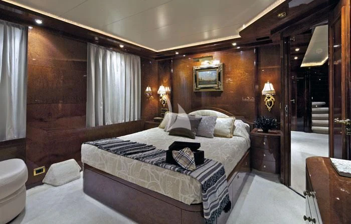a hotel room with a bed aboard O'RION Yacht for Charter