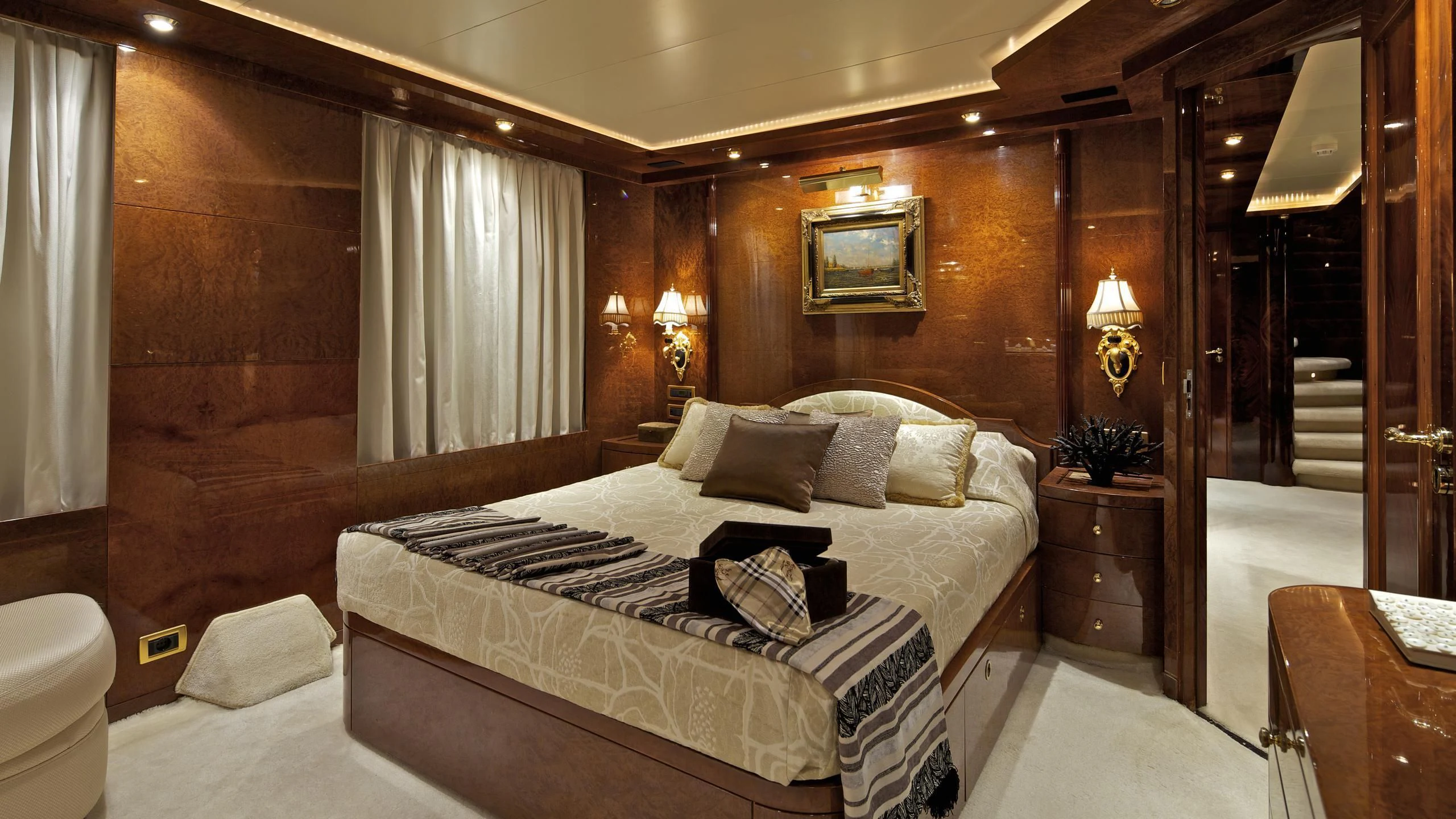 a room with a bed and a mirror aboard O'RION Yacht for Charter