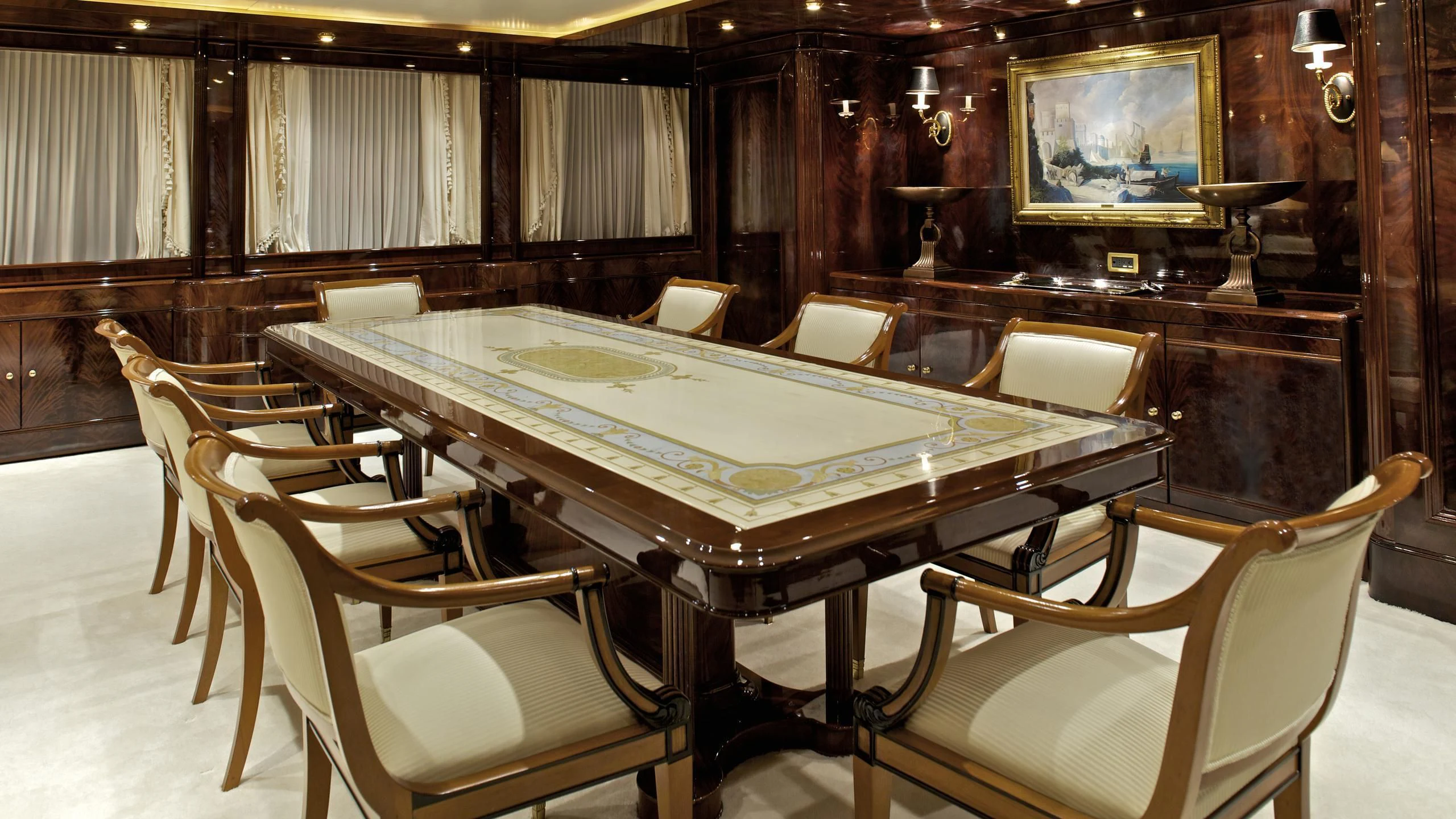 a room with a table and chairs aboard O'RION Yacht for Charter