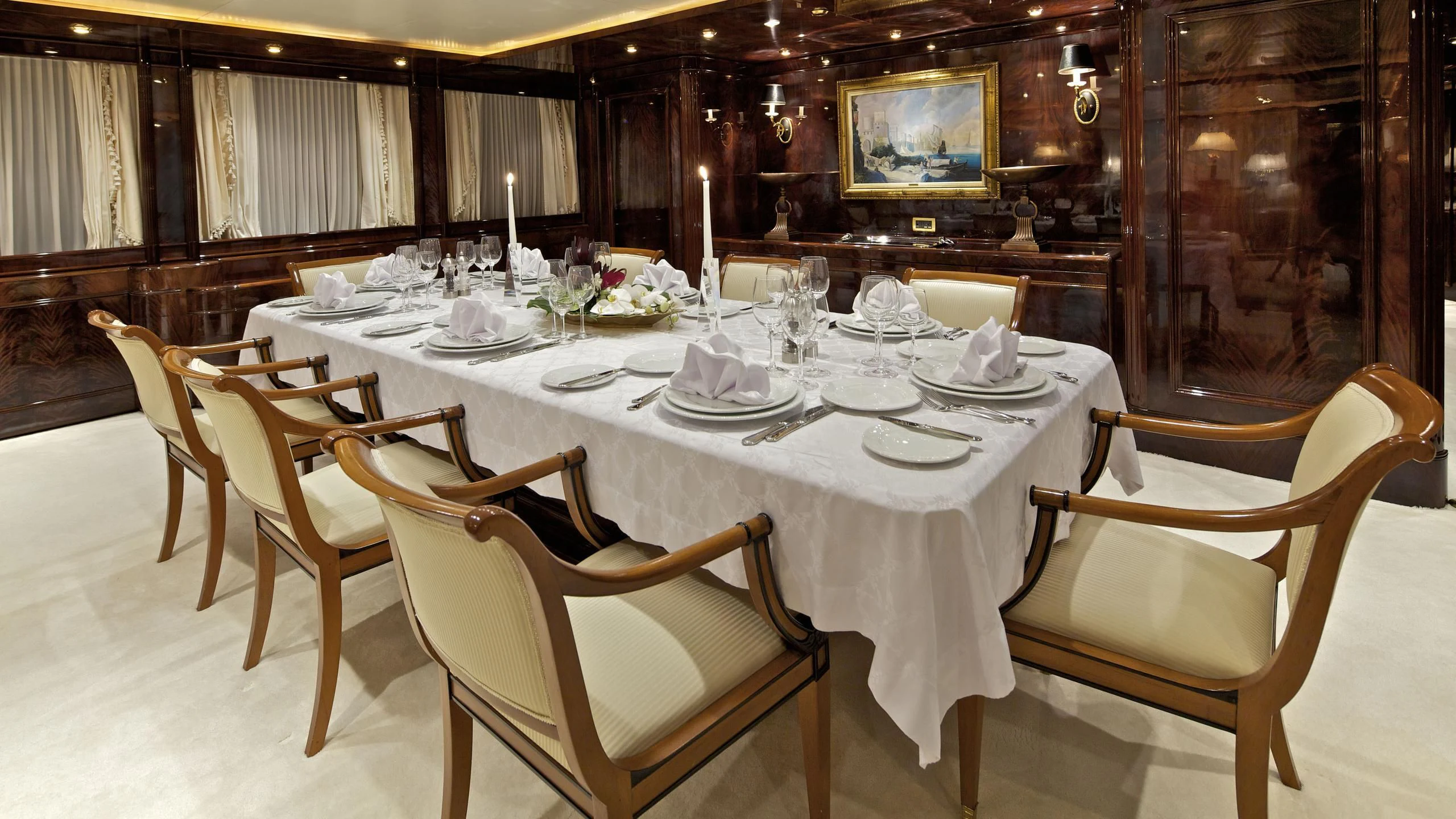 a dining table set for a formal dinner aboard O'RION Yacht for Charter