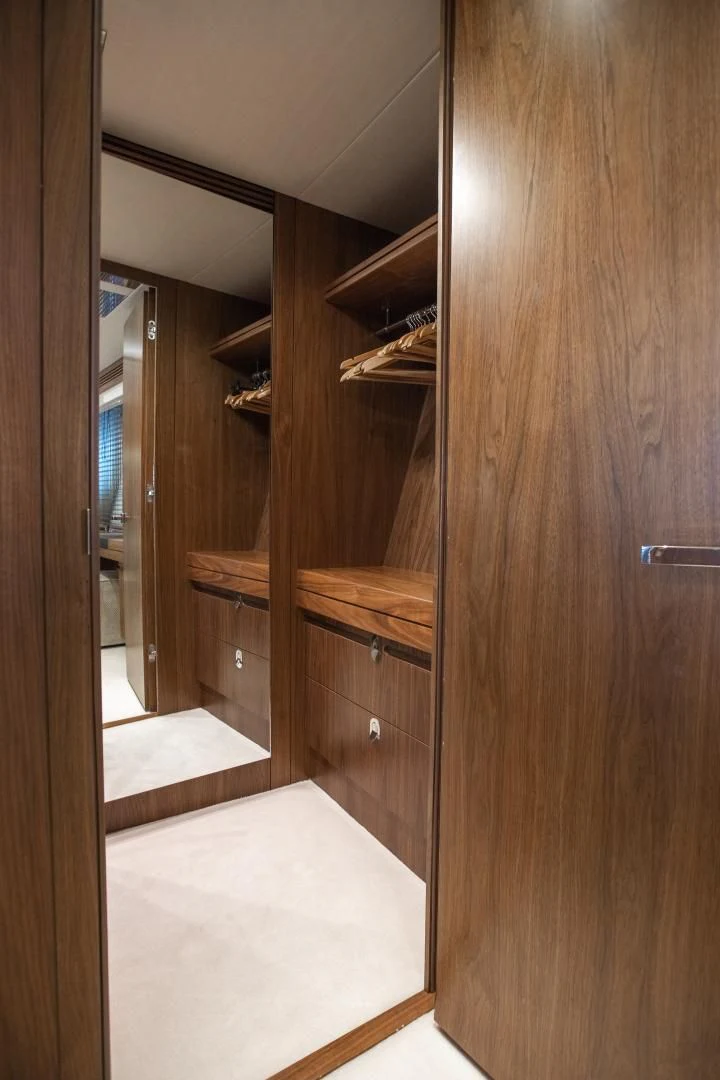 a wooden closet with a wood door aboard FREAKY FRANKS Yacht for Sale