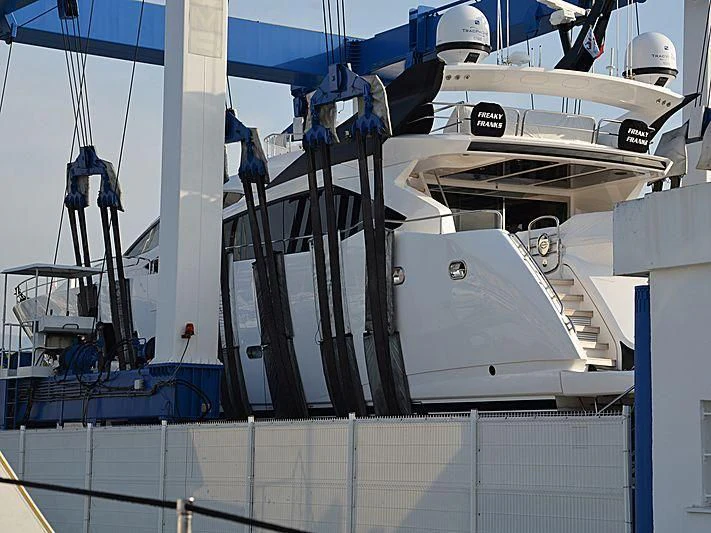 a large boat with a white stripe aboard FREAKY FRANKS Yacht for Sale