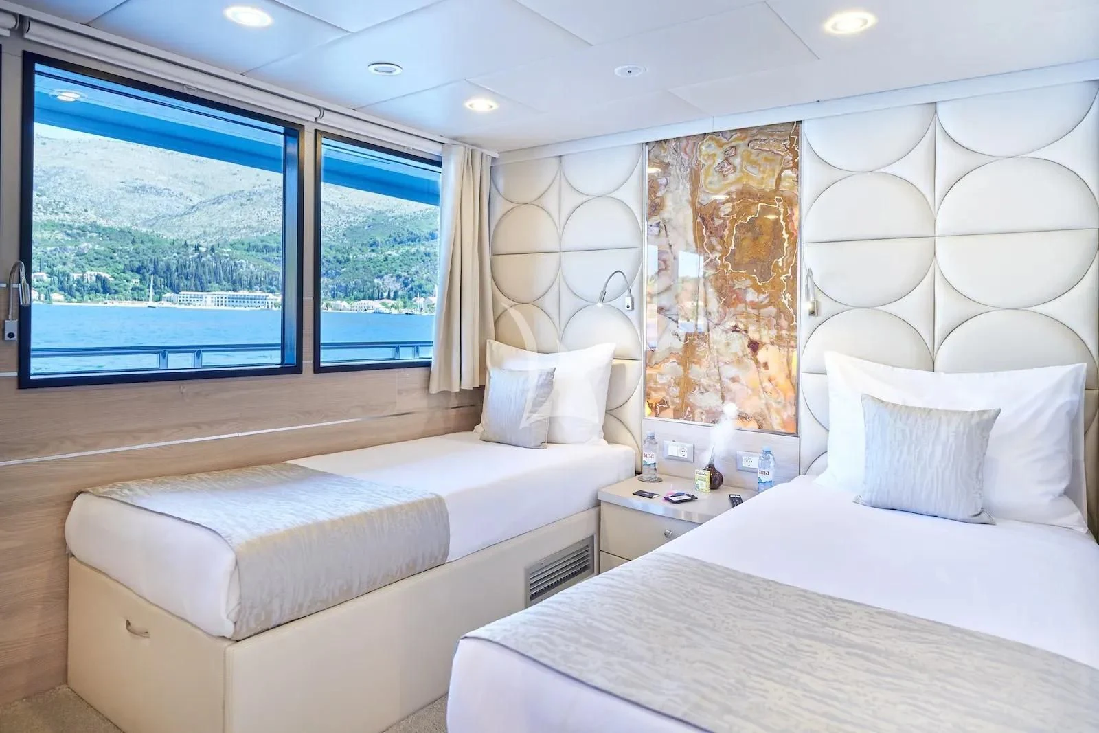 a room with two beds aboard AETERNA Yacht for Sale