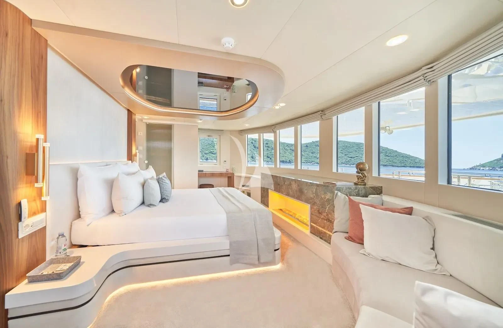 a room with a bed and a couch aboard AETERNA Yacht for Sale