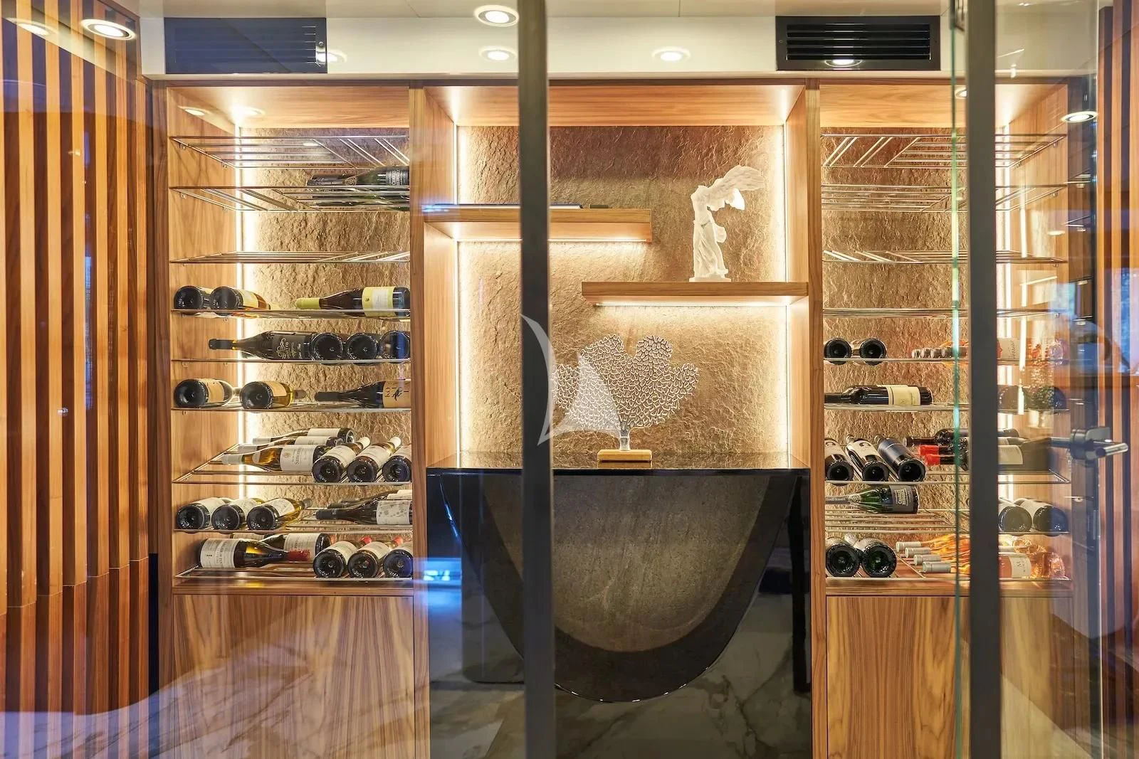 a large room with shelves of wine aboard AETERNA Yacht for Sale