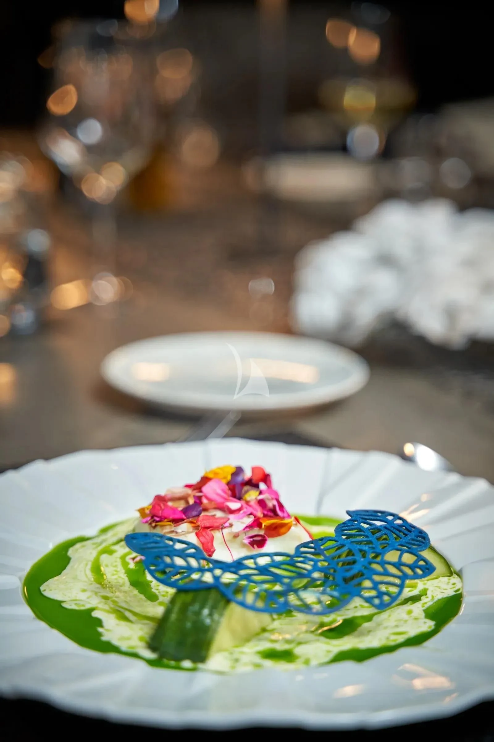 a cake on a table aboard AETERNA Yacht for Sale