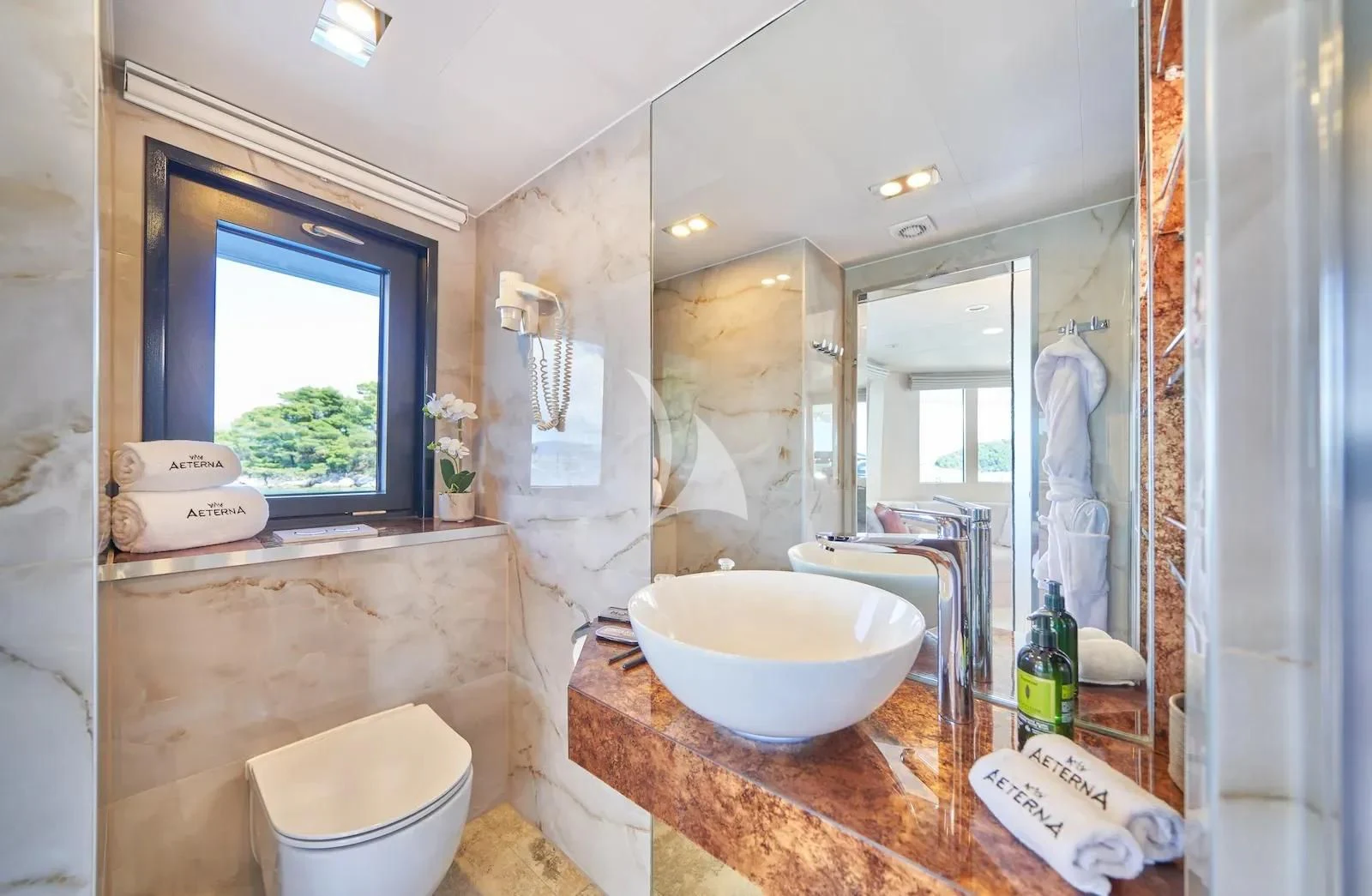 a bathroom with a sink and a mirror aboard AETERNA Yacht for Sale