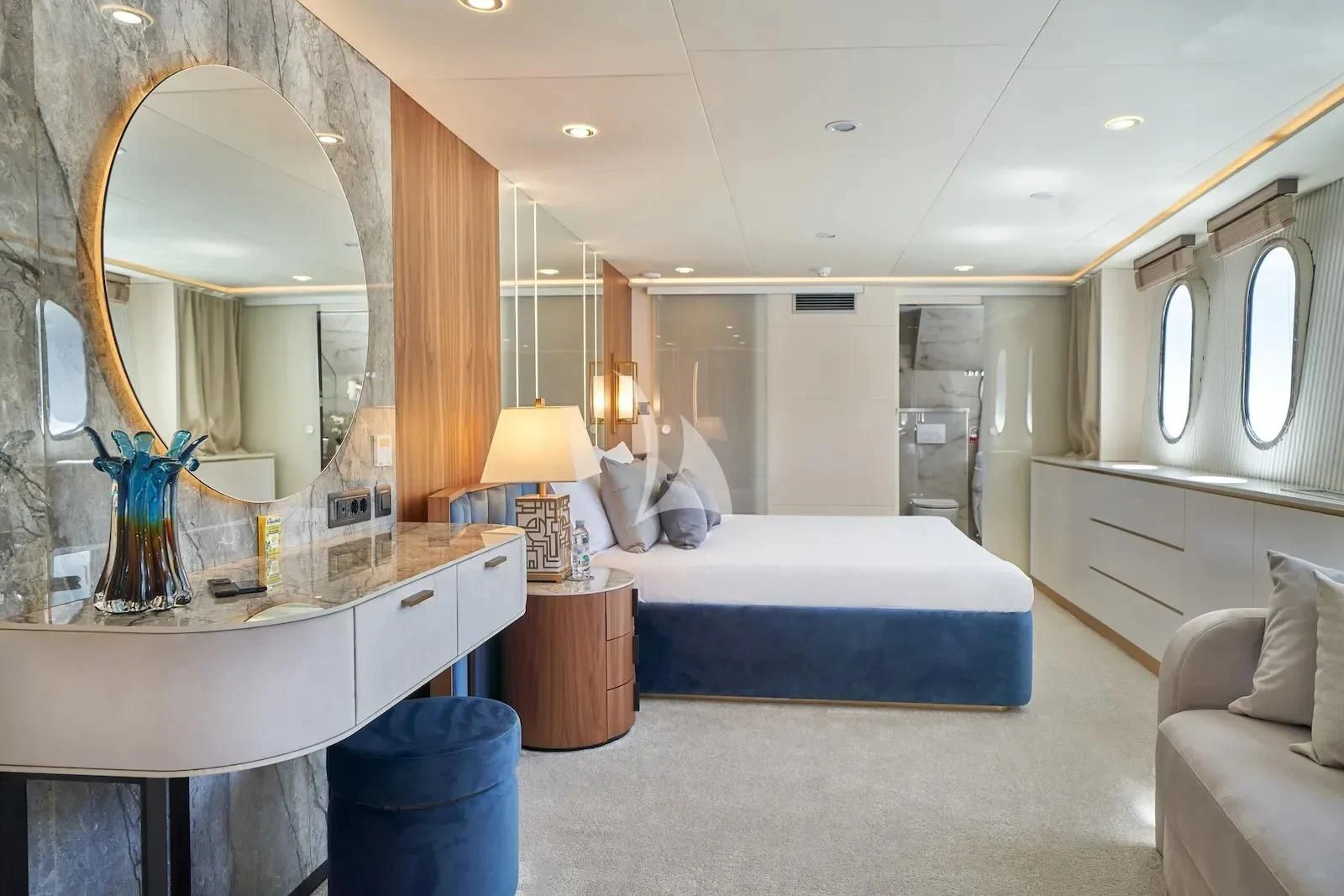 a bedroom with a bed and a mirror aboard AETERNA Yacht for Sale