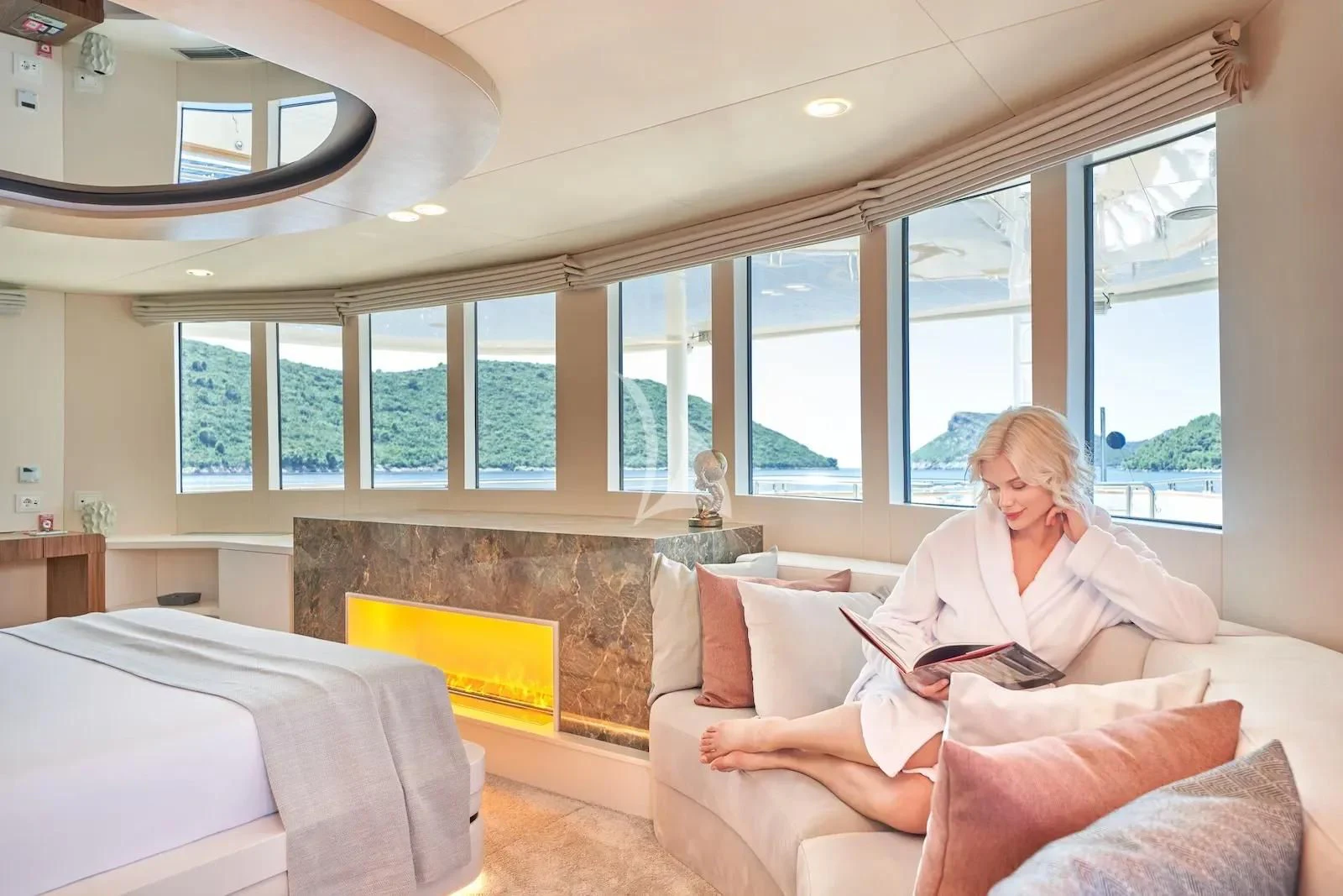 a person reading a book aboard AETERNA Yacht for Sale