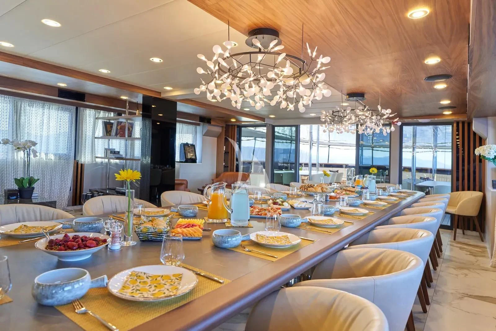 a large dining room table aboard AETERNA Yacht for Sale