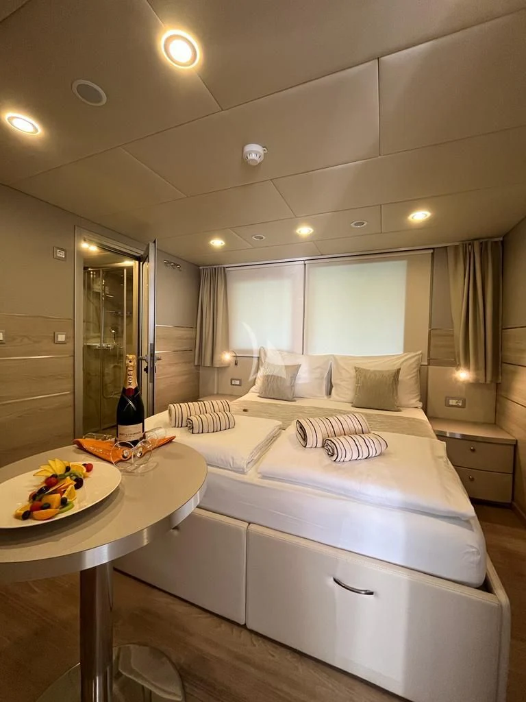 a bed in a room aboard AETERNA Yacht for Sale