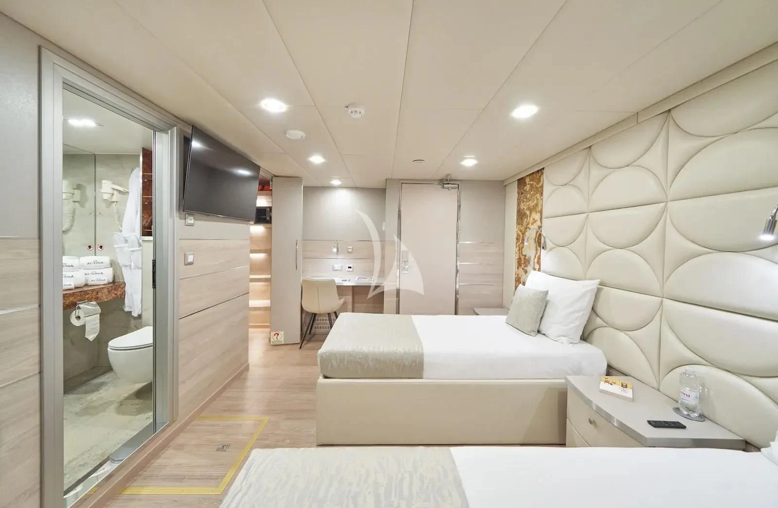 a modern bathroom with a bed aboard AETERNA Yacht for Sale