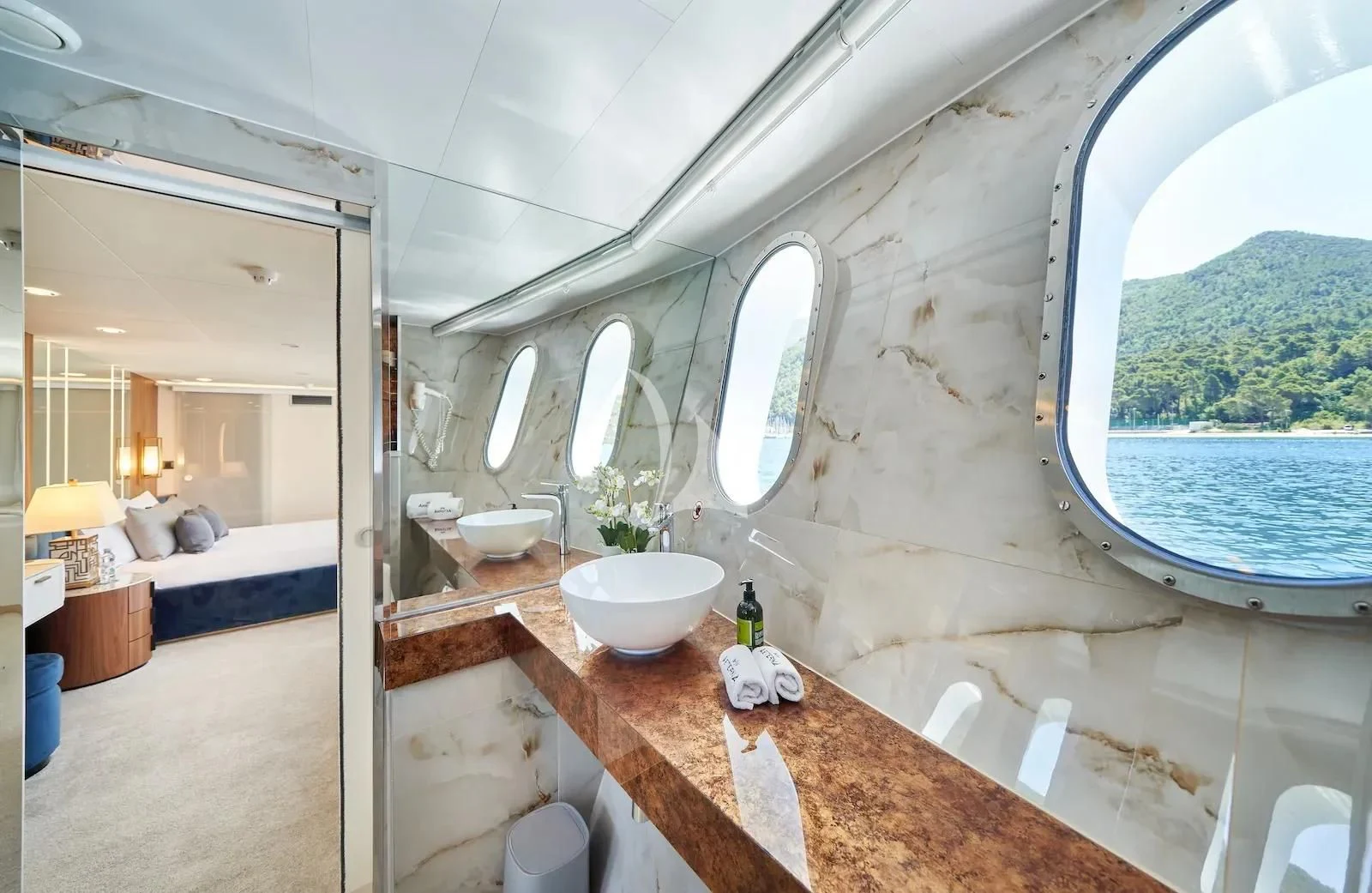 a bathroom with a large jacuzzi tub and a large window aboard AETERNA Yacht for Sale