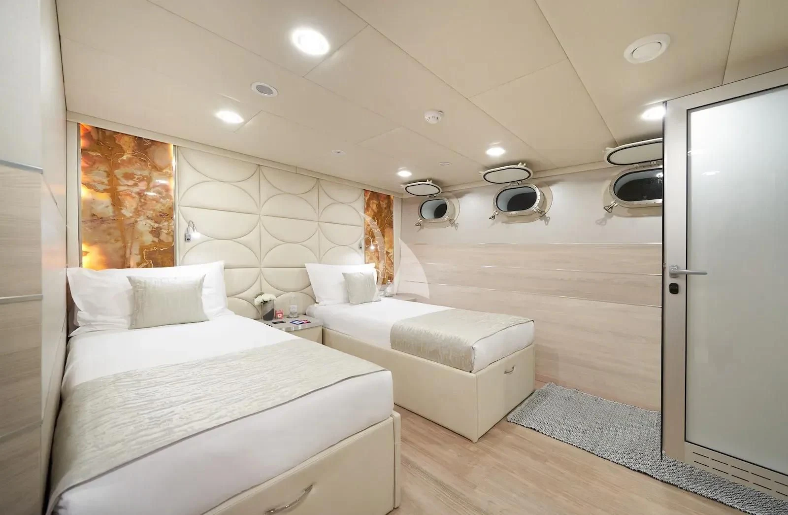 a room with two beds aboard AETERNA Yacht for Sale
