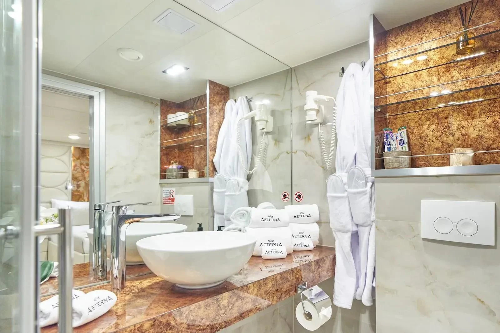 a bathroom with a large mirror aboard AETERNA Yacht for Sale