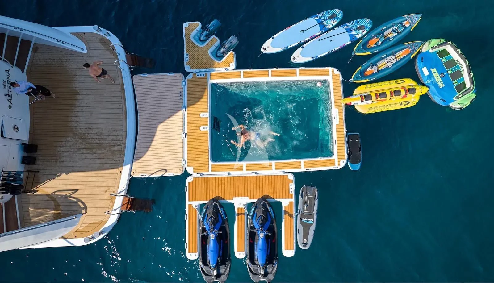 a yellow and blue vehicle aboard AETERNA Yacht for Sale