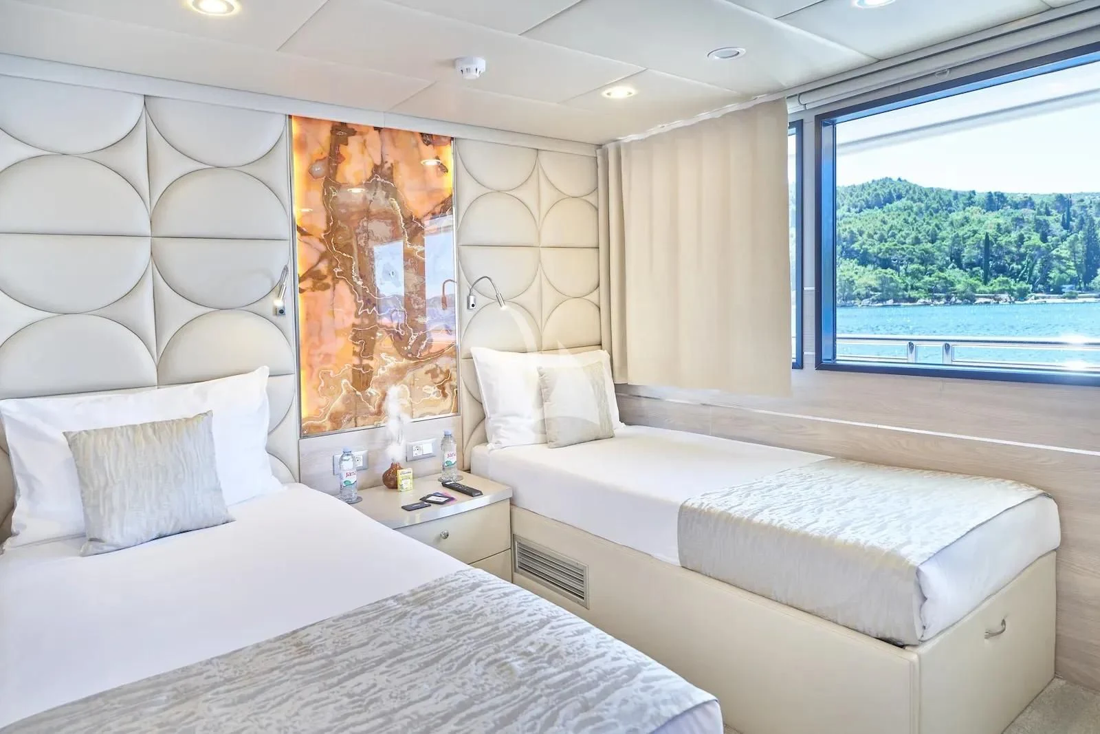a room with two beds aboard AETERNA Yacht for Sale