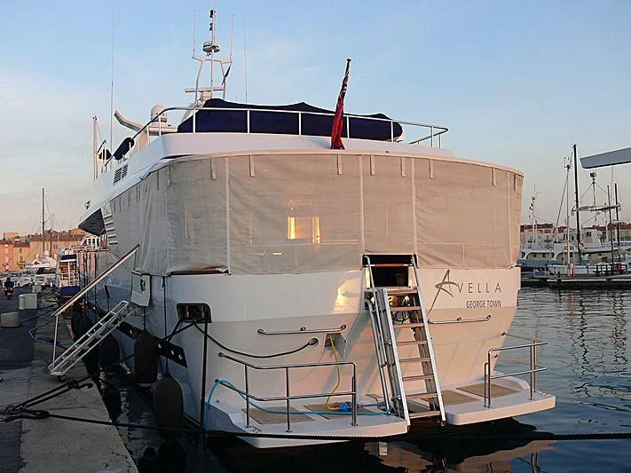 a large white boat in a harbor aboard AVELLA Yacht for Sale