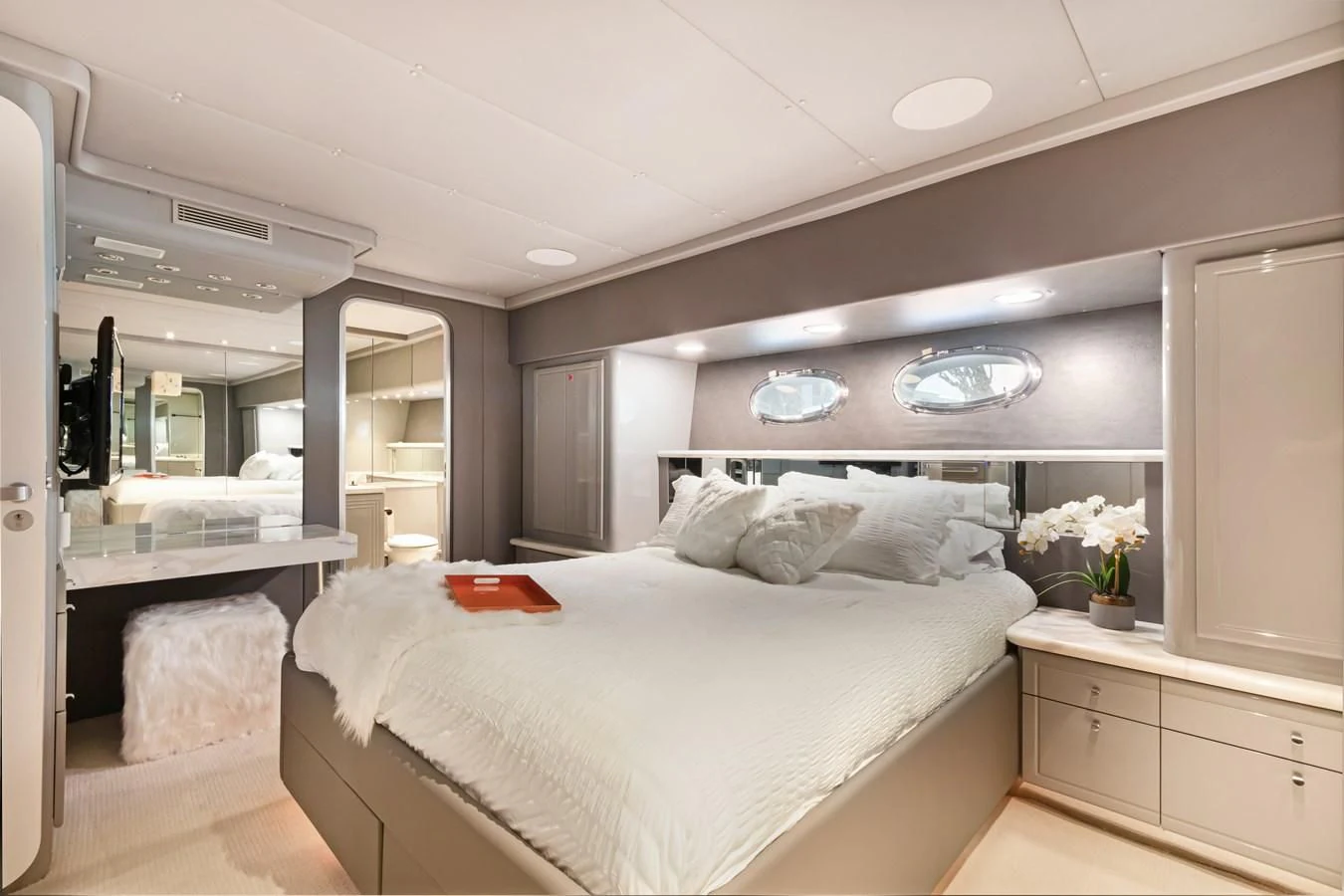 a bedroom with a bed and a mirror aboard MARY KATHLENE Yacht for Sale