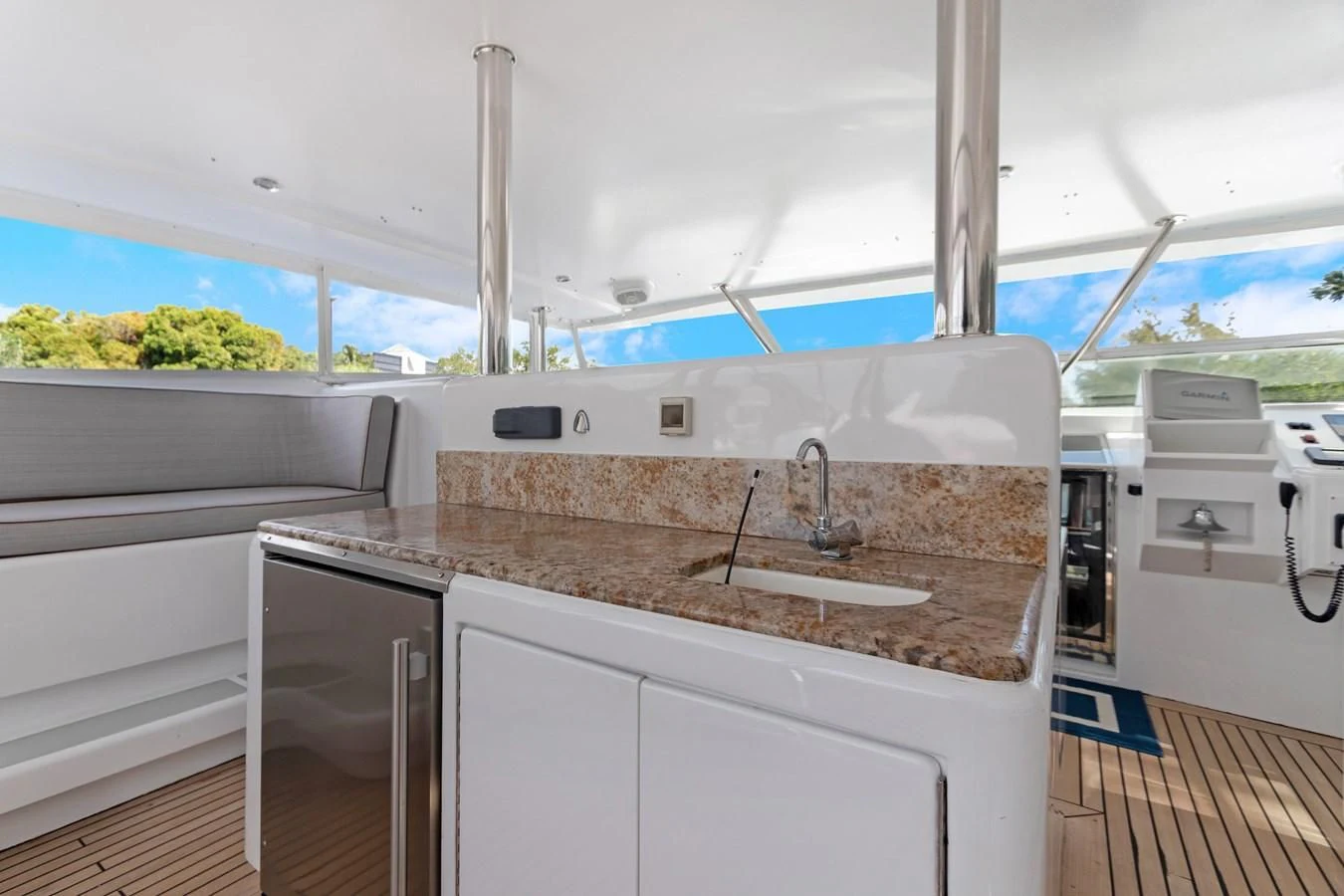 a kitchen with a sink and a large window aboard MARY KATHLENE Yacht for Sale