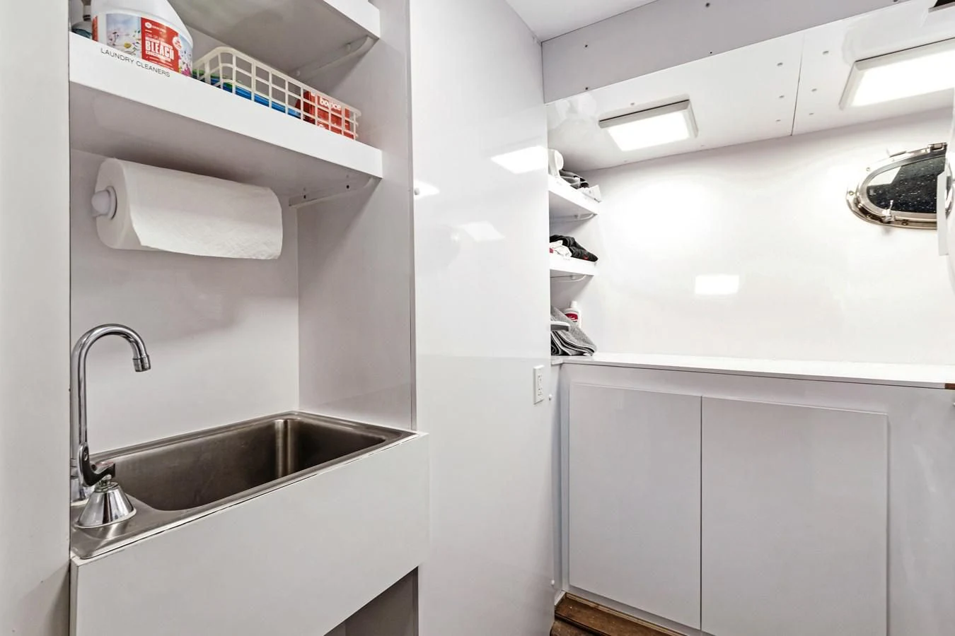 a kitchen with a sink and shelves aboard MARY KATHLENE Yacht for Sale