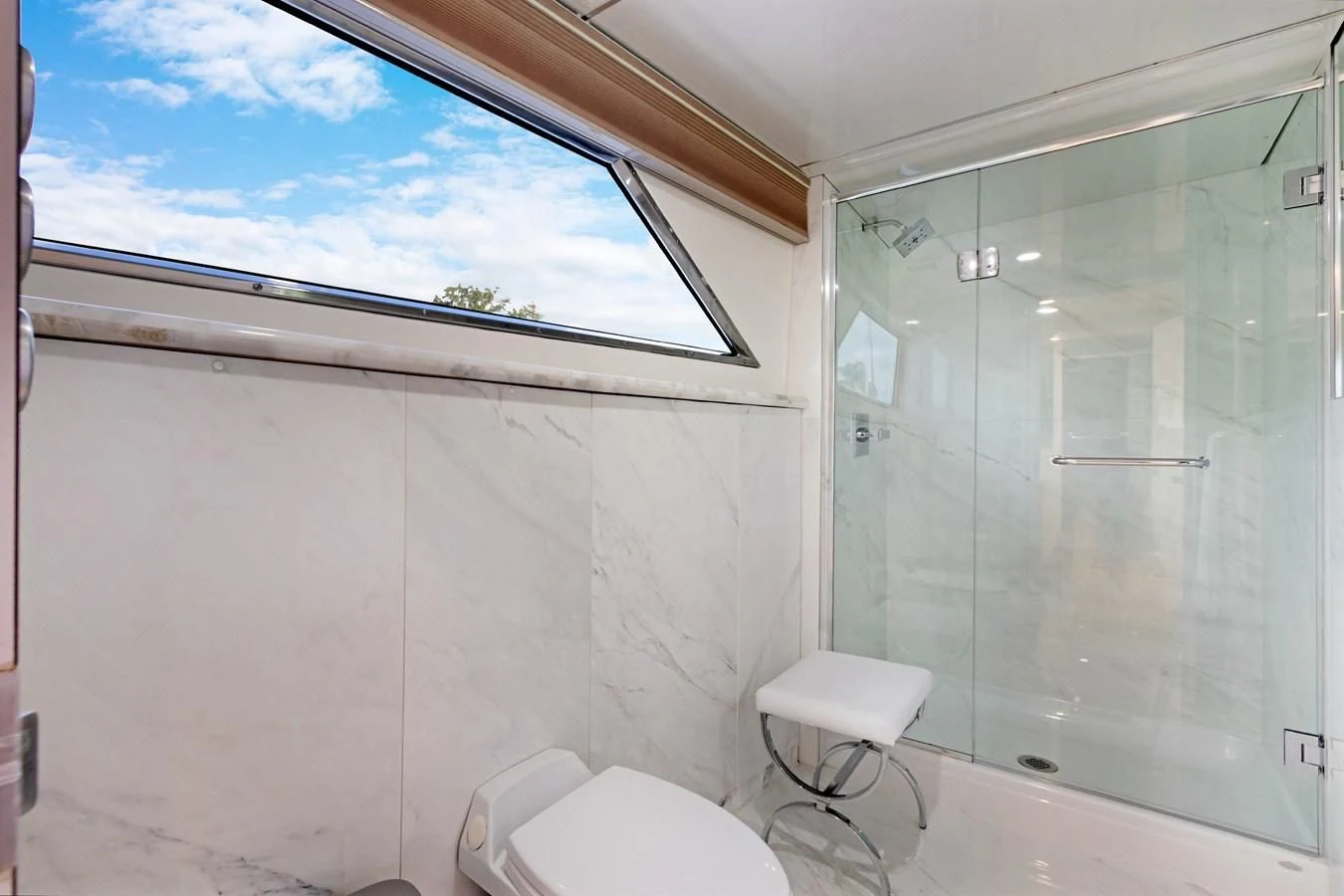 a bathroom with a glass shower aboard MARY KATHLENE Yacht for Sale