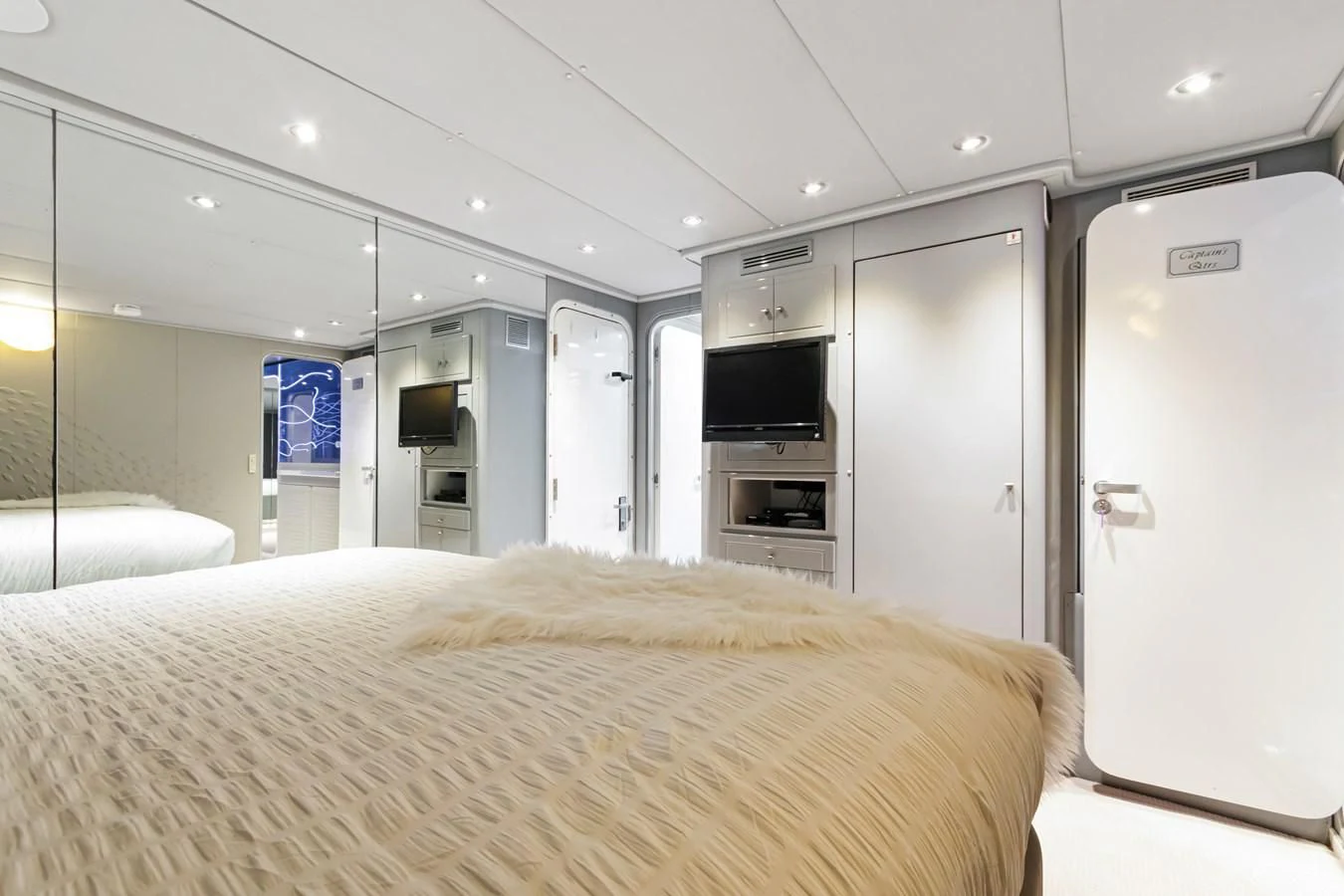 a bedroom with a bed and a television aboard MARY KATHLENE Yacht for Sale