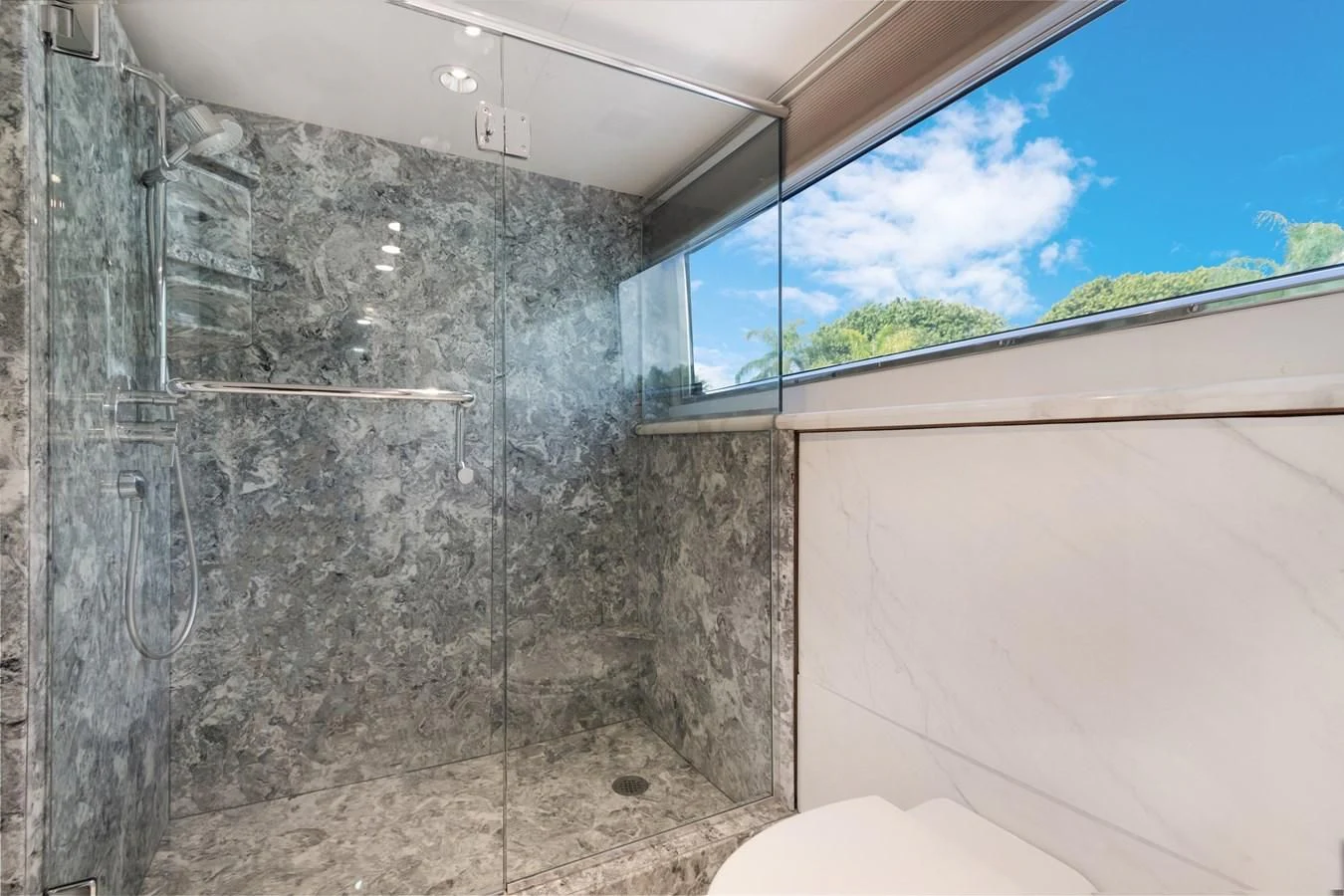 a bathroom with a glass shower aboard MARY KATHLENE Yacht for Sale