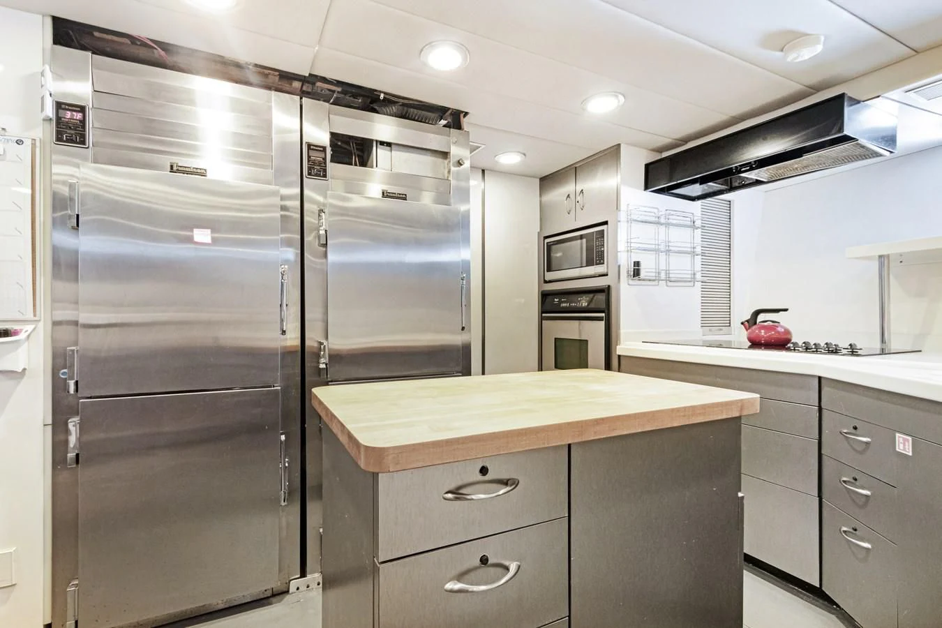 a kitchen with stainless steel appliances aboard MARY KATHLENE Yacht for Sale