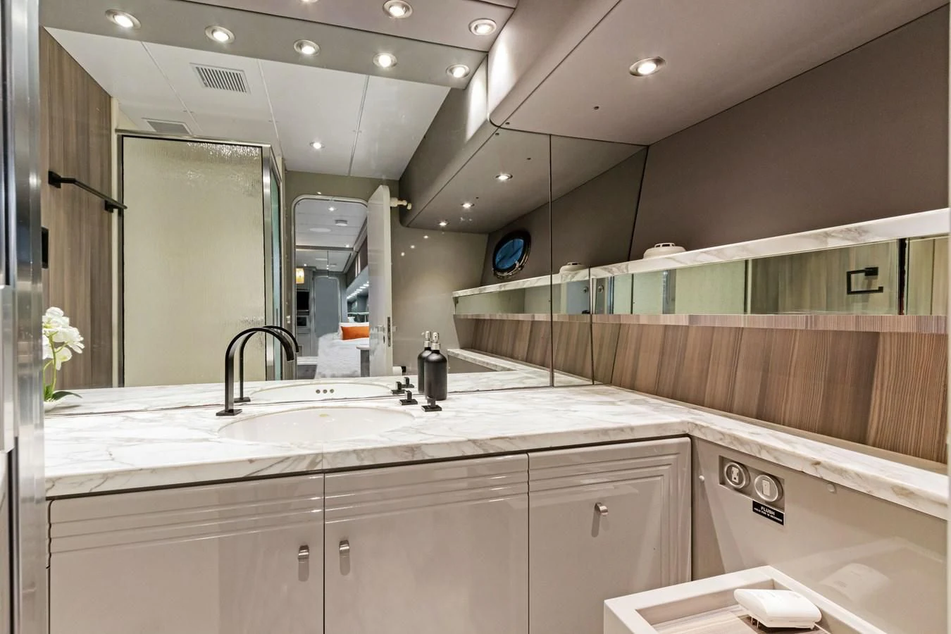 a bathroom with a large mirror aboard MARY KATHLENE Yacht for Sale
