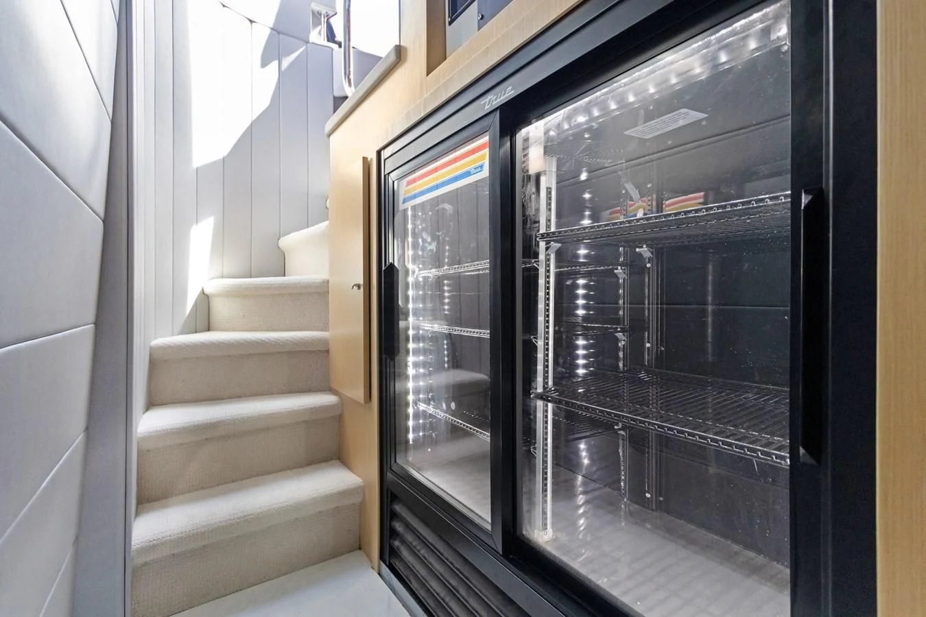 a staircase leading to a glass case aboard MARY KATHLENE Yacht for Sale