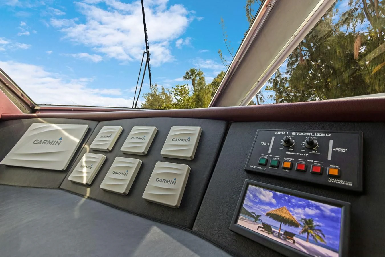 a car dashboard with a screen and buttons and a screen with a map aboard MARY KATHLENE Yacht for Sale